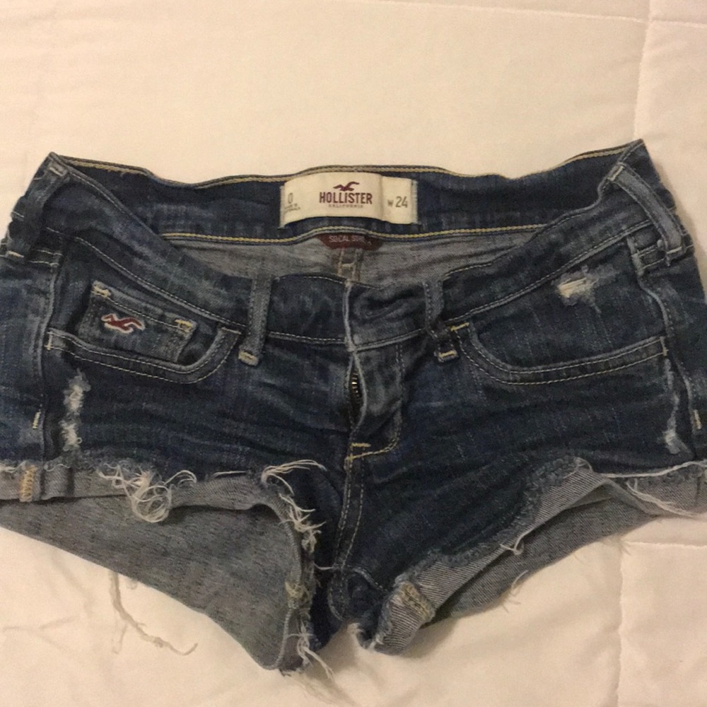 Dark blue torn up short shorts